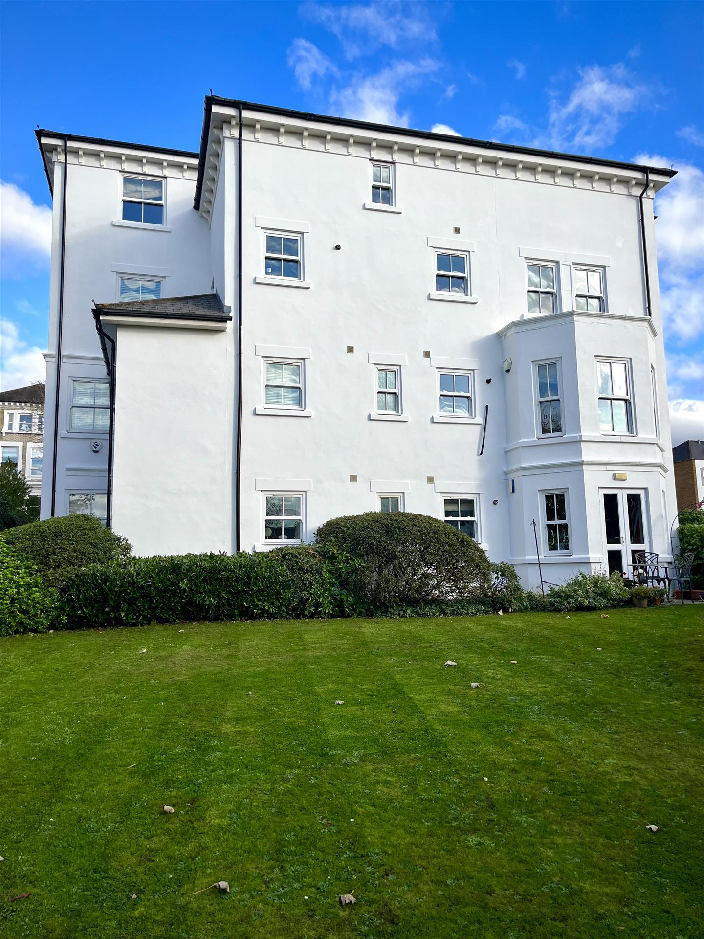 Grand white Victorian apartment building garden elevation, Essex